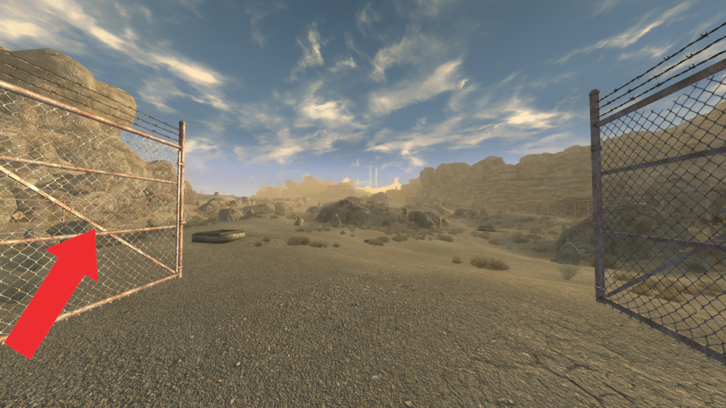 Gate that leads to Hidden Valley. Path to the bunker highlighted by an arrow. | Fallout: New Vegas - Power Armor Training Perk Prerequisite Quest