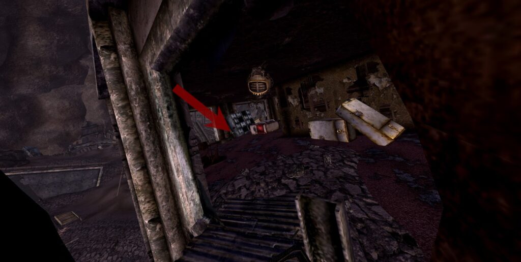 View from the exit from the cave, corpse with the Elite Riot Gear visible. | Fallout: New Vegas