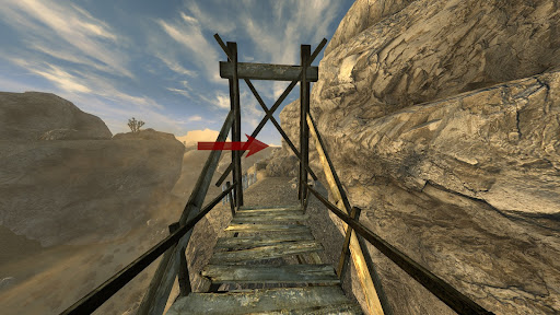 Keep following the narrow path. You’ll walk across a wooden bridge at one point | Fallout: New Vegas